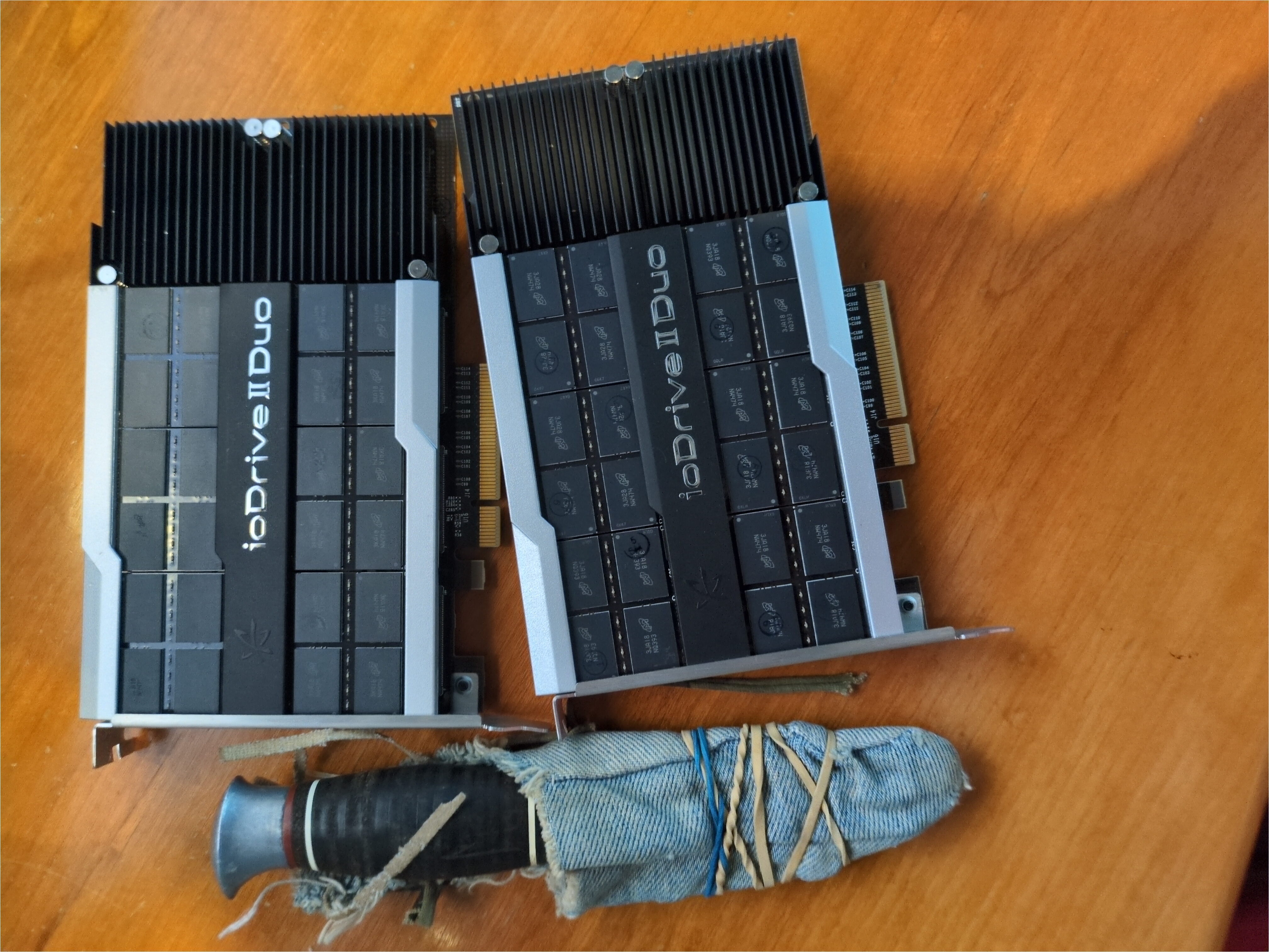 An image of the two ioDrive-s on a wooden tabletop